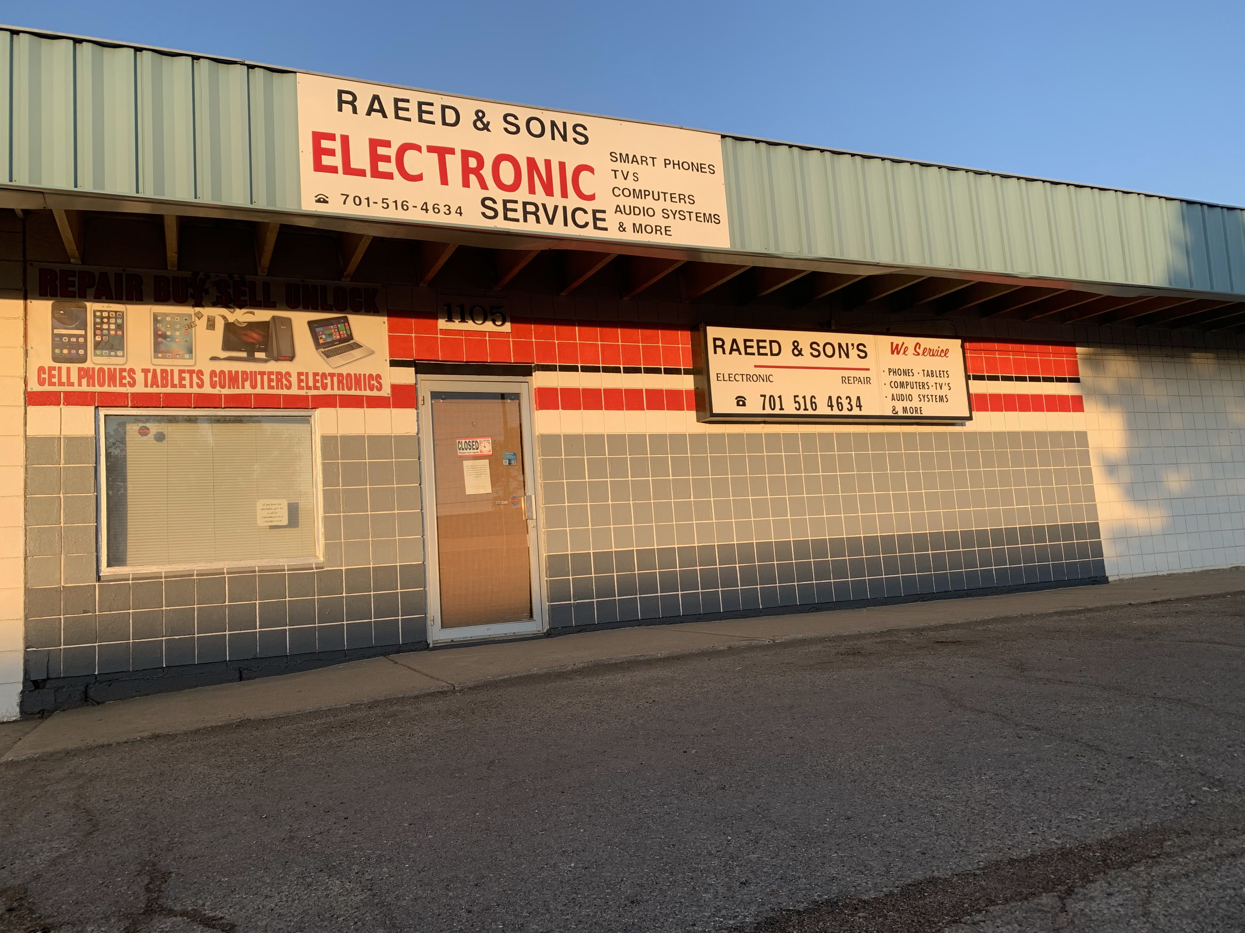 Storefront sign at sunset