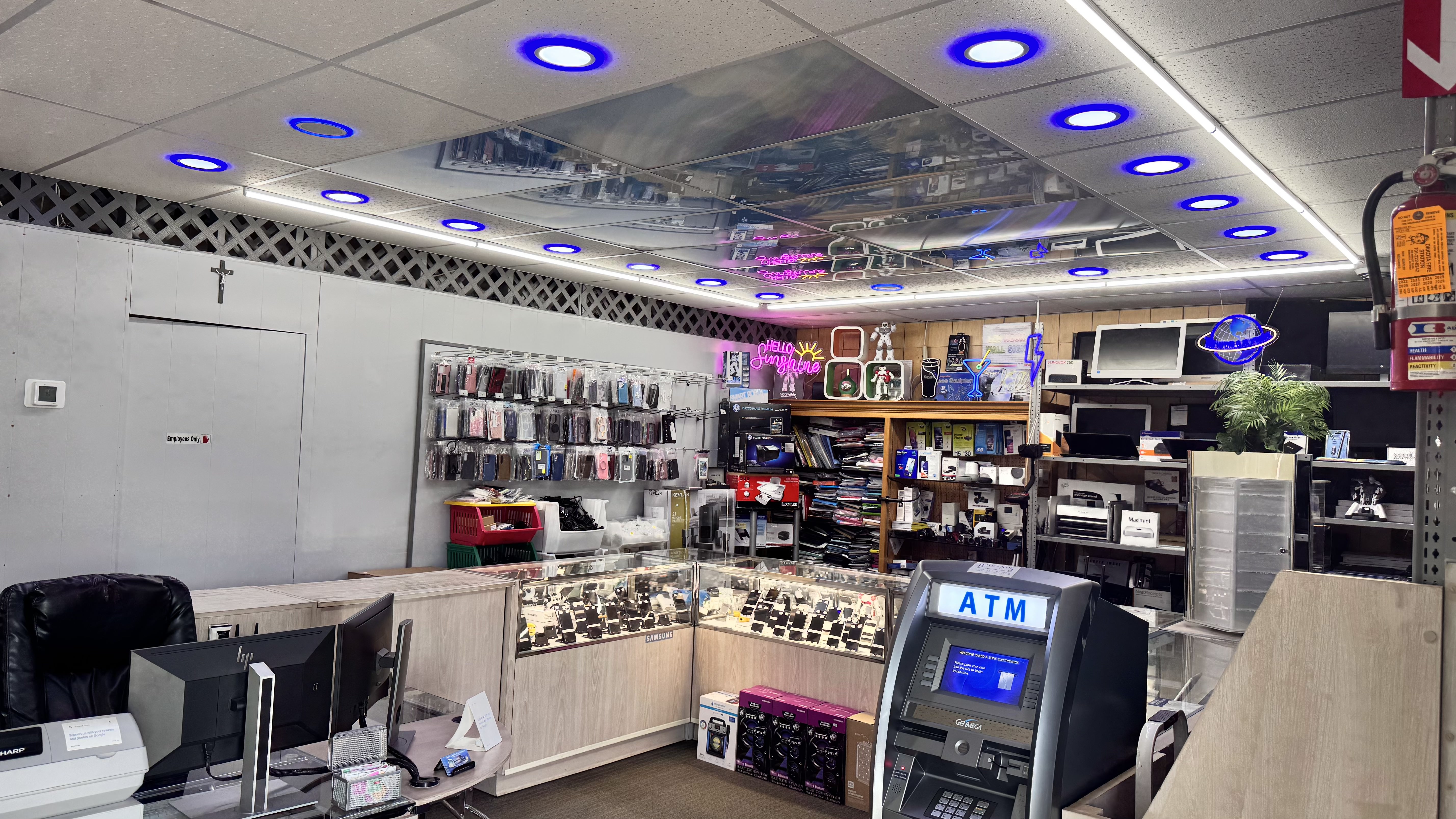 Inside the Raeed & Sons shop — front counter and phone display